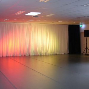 Studio A with lights on curtain at front of room